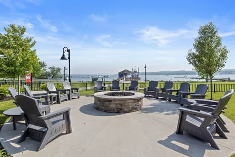Gather around the shared fire pit with a view of the lake—perfect for cozy evenings by the water