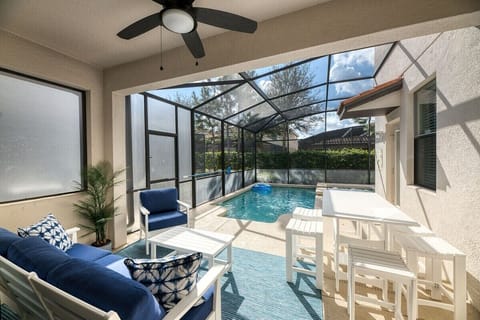 Backyard lanai with BBQ and TV