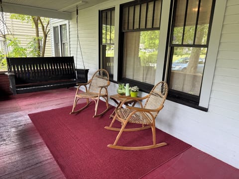 Two rockers and the vintage swing out front and 6 additional seats back,firepit