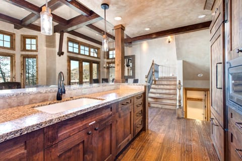 Prep and entertain with ease in this fully equipped kitchen with bar seating and open flow. VIN-17