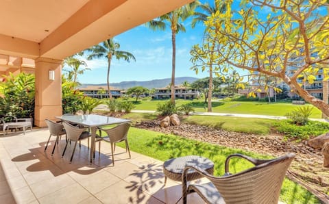 Tranquil patio view with lush greenery and mountain backdrop serenity. HKK-104