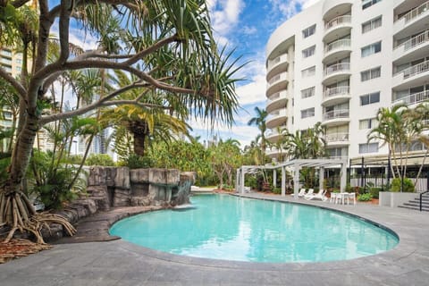 Cool off in the lagoon-style pool surrounded by tranquil gardens and a rock waterfall—perfect for a midday dip or lazy afternoon.