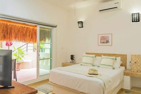 Bright bedroom with queen-size bed