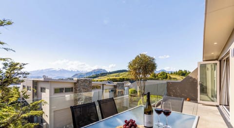 Unwind on the deck with stunning mountain views -  the perfect spot for a glass of wine at sunset