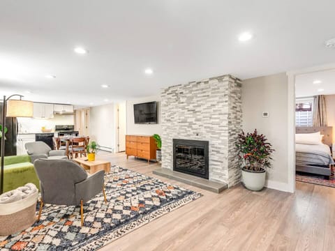 Bright living room with modern fireplace + smart TV — the perfect spot to relax