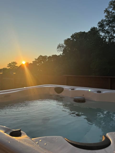 Hot Tub Oasis: Unwind in the bubbling warmth while soaking in stunning sunset views!