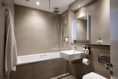 Eco-friendly toiletries, hair dryer, slippers, towels