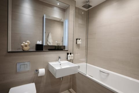 Eco-friendly toiletries, hair dryer, slippers, towels