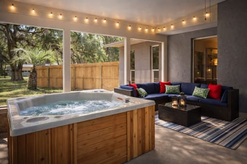 Unwind in the screened-in hot tub—spa. Towels provided for your convenience