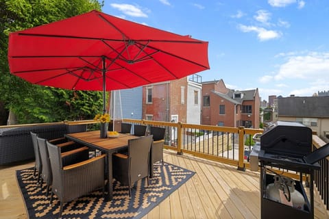 Unwind on the spacious deck with city views, outdoor dining, and a BBQ grill.