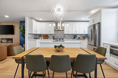 Spacious dining area with seating for eight, perfect for sharing meals and making memories.