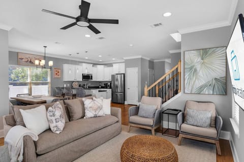 A serene living room designed for comfort and modern charm with a brand new sleeper sofa to comfortably host extra friends and family!