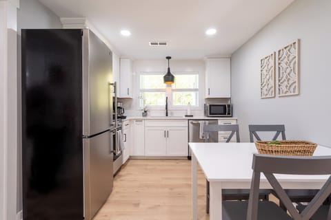 Bright and modern kitchen with a dining space perfect for home-cooked meals.
