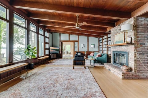 Living Room: Experience the warmth of wood beams and stunning views from expansive windows!