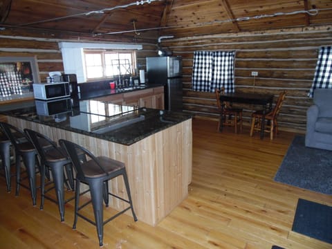 KITCHEN: A full view of the kitchen, with the small dining table in the background