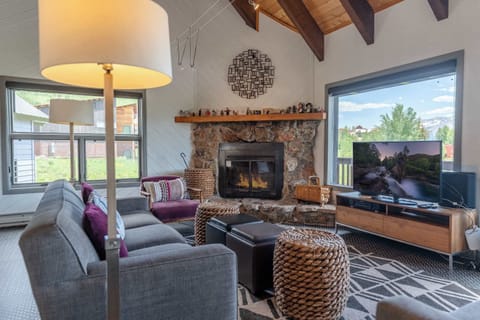 Living room w/wood fireplace, TV