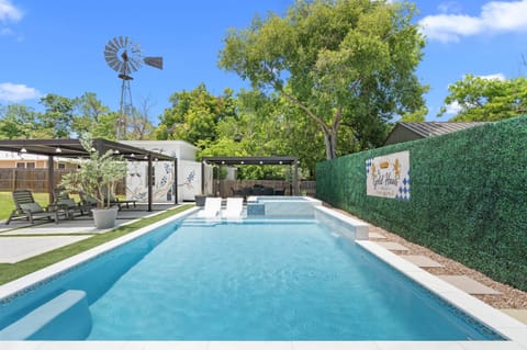 Your outdoor oasis with a stunning heated pool and hot tub, right in the heart of DT Fredericksburg!