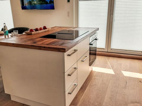 Flooring, Cabinetry, Countertop, Wood, Floor, Wood Flooring, Furniture, Kitchen, Drawer, Interior Design