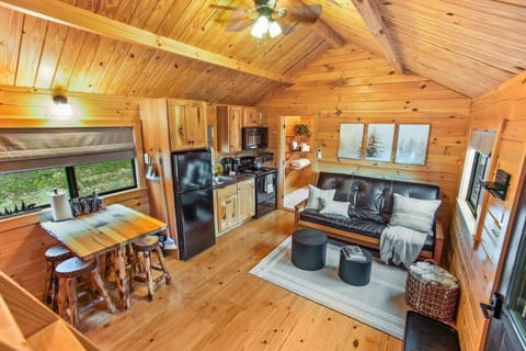 Open living with beautiful wood walls/ceiling.