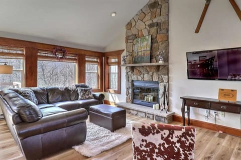 Cozy living room with fireplace and mountain views