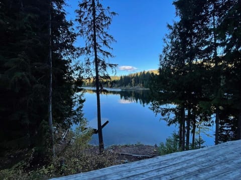 Early morning sun catches the hills across the lake.