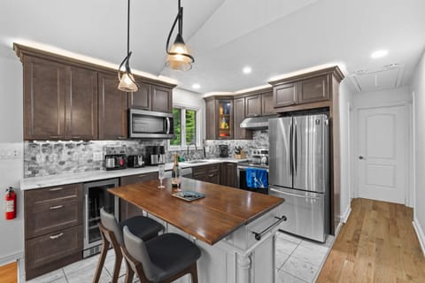 Cook with ease in this modern kitchen—includes full appliances and island counter