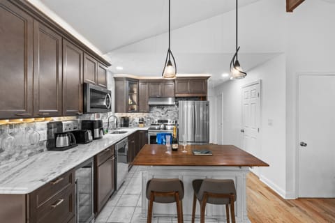 Cook with ease in this modern kitchen—includes full appliances and island counter