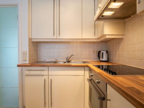 Countertop, Kitchen Appliance, Kitchen, Cabinetry, Major Appliance, Flooring, Interior Design, Wood, Plumbing Fixture, Furniture