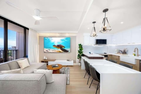 Welcome to your beautifully renovated condo, where the open-concept living, dining, and kitchen area invites you to relax and create unforgettable island memories together.