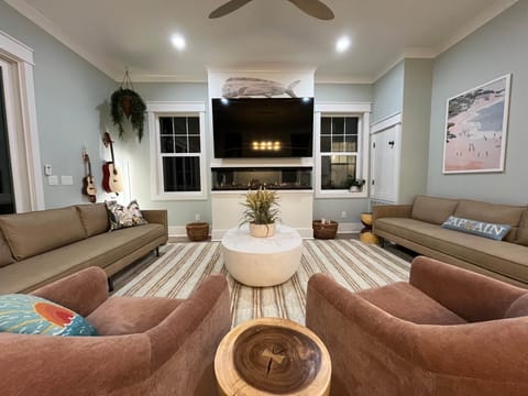 Comfortable Spacious Living Room For Entertainment with Mahi Tuna, Modern Fire Place, Roku TV