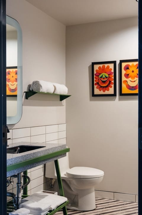 Unwind with fresh towels and a sleek vanity setup.