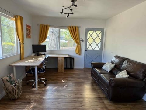A comfortable living room with high-speed Wi-Fi and dedicated workspace. 
