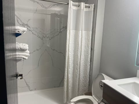 Room, 2 Queen Beds, Non Smoking | Bathroom | Combined shower/tub, hair dryer, towels