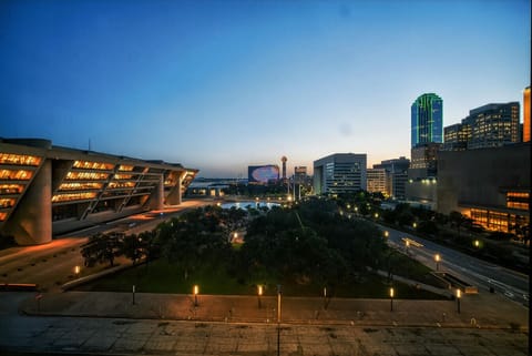 Stunning evening skyline view overlooking downtown Dallas, highlighted by illuminated city architecture and iconic landmarks.
