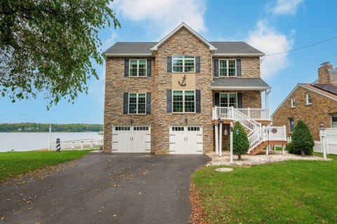 Welcome! A paved driveway leads to the south entrance of this waterfront home.