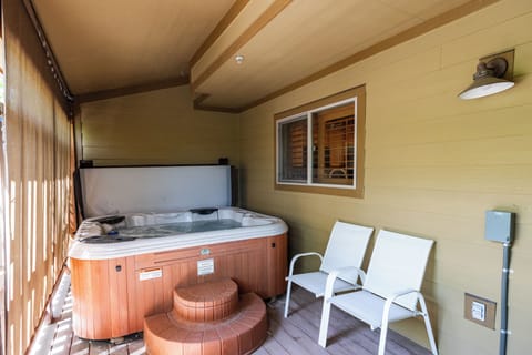- Deck with hot tub and comfortable seating for two  
- Refreshing space to relax morning or evening hours  
- Private retreat for unwinding in the mountain air