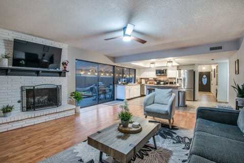 Family room with a large TV overlooking the yard. 