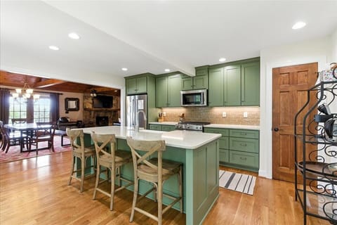 The open layout between the kitchen and living room keeps you connected to friends and family while you cook.