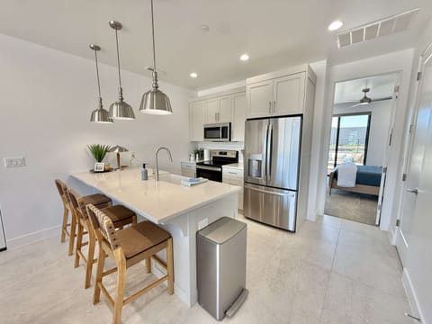 The fully stocked kitchen features top of the line appliances, plenty of counter space for cooking your favorite meals, and seating for 3 at the bar