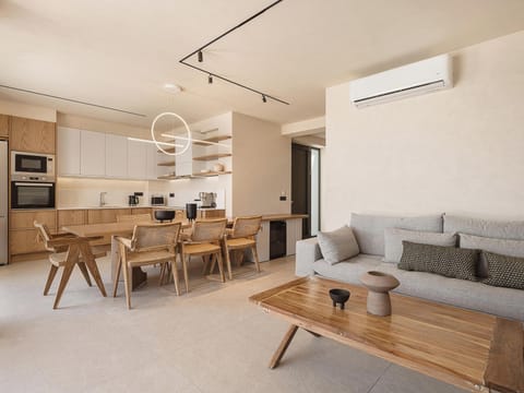 The living room features a sofa, a Marshall Speaker, and a 55” Samsung TV