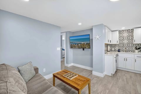 Living room has a smart TV perfect for settling in for movie night after a day at the pool or beach