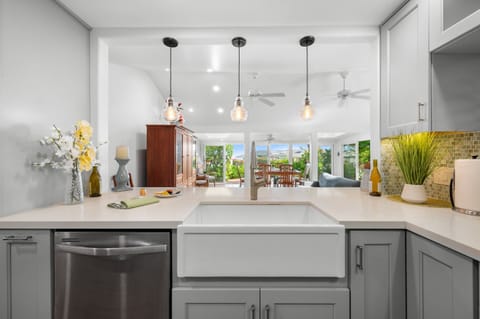 Stay connected with the living room through a charming peekaboo pass-through