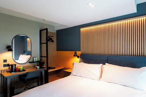 Desk, laptop workspace, blackout drapes, iron/ironing board