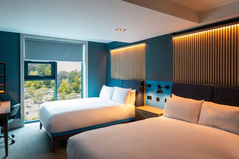 Family Room, 2 King Beds | Desk, laptop workspace, blackout drapes, iron/ironing board