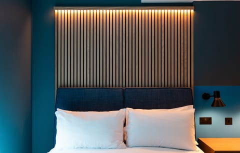 Desk, laptop workspace, blackout drapes, iron/ironing board