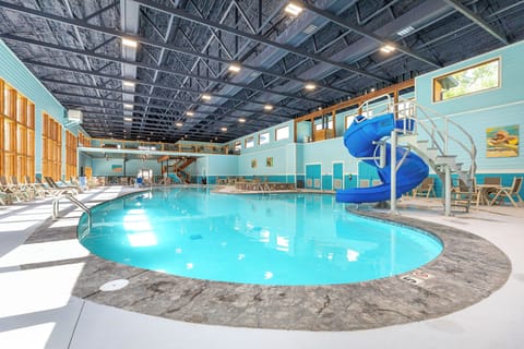 Community indoor pool with slide and hot tub!