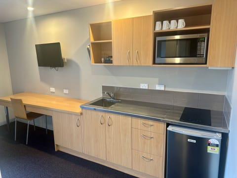 Mini-fridge, microwave, stovetop, cookware/dishes/utensils