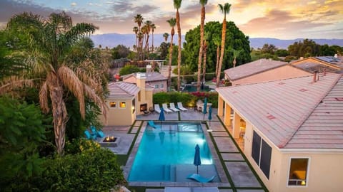 Sunset skies and swaying palms set the scene for evenings by the pool and fire pit.