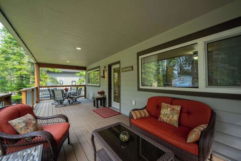 Sink into plush outdoor furniture on your private covered deck, where morning coffee and evening conversations feel perfectly at home.