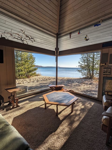 LIVING ROOM #1:  The beautiful beach view of crystal lake from the cozy interior of the living room